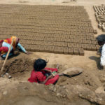 Family working in brick kiln in India