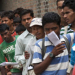 Nepali workers queueing for permits to migrate to the Middle East