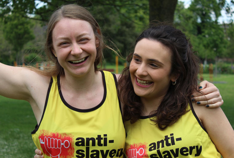 Two runners wearing Anti-Slavery vests