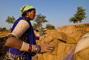female worker in a brick kiln in India