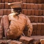 A child works in a brick kiln. Credit Bharat Patel.