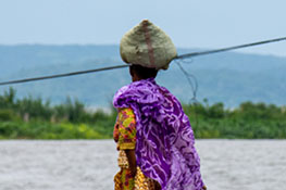 A woman carries a bundle on her head