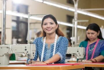 A smiling woman in a textile factory