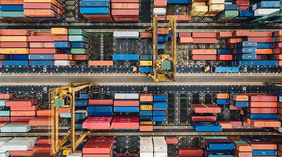 An aerial photo of thousands of shipping containers in a dockyard