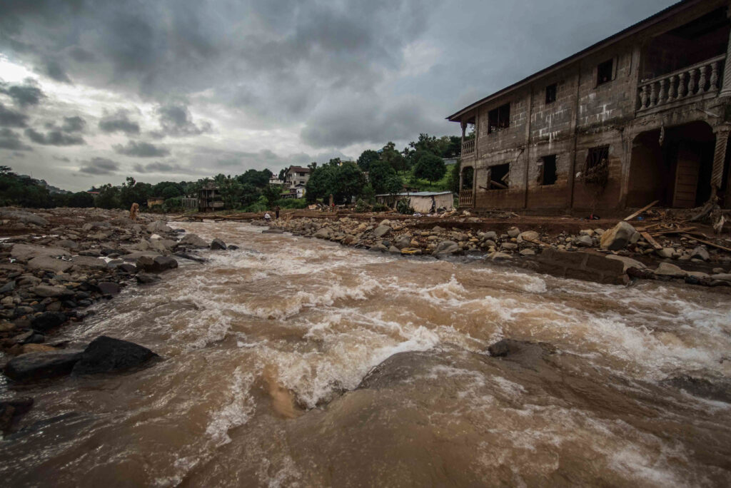 An image of a river rising with flood water