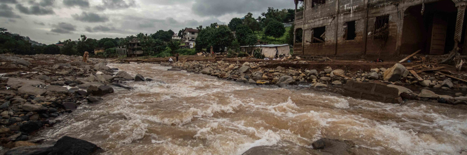 An image of a river rising with flood water