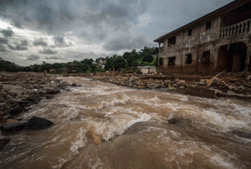 An image of a river rising with flood water